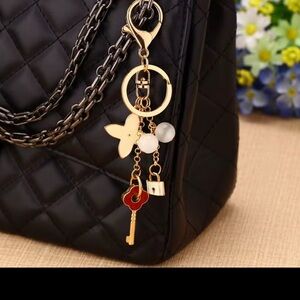 Chic Gold and Red Key Holder with Floral Bag Charms